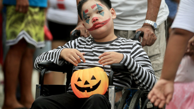 A boy wearing a Halloween costume joins a parade in Kawit, Cavite, Philippines, 29 October 2023